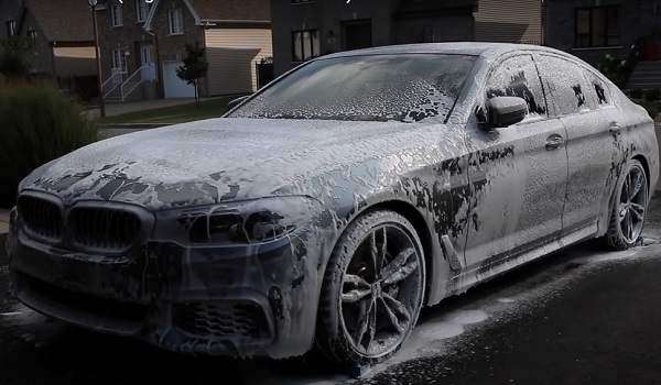 applying biodegradable soap on BMW 428i