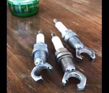 A Bottle Opener made of spark plugs