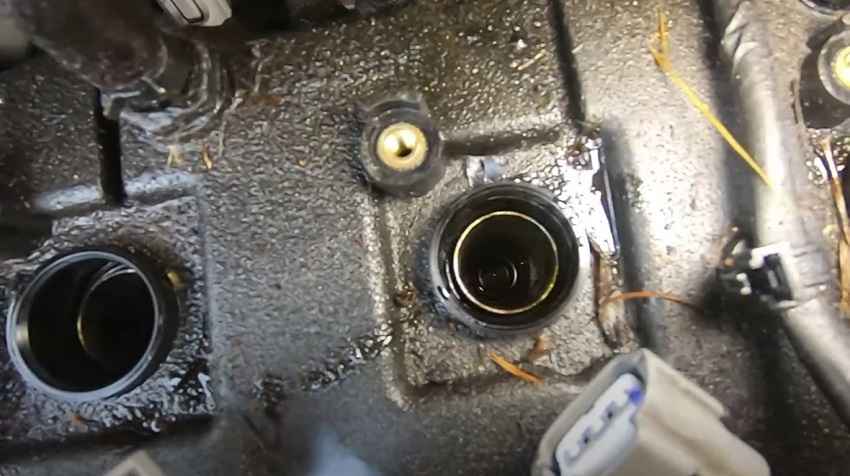 what to spray in spark plug hole
